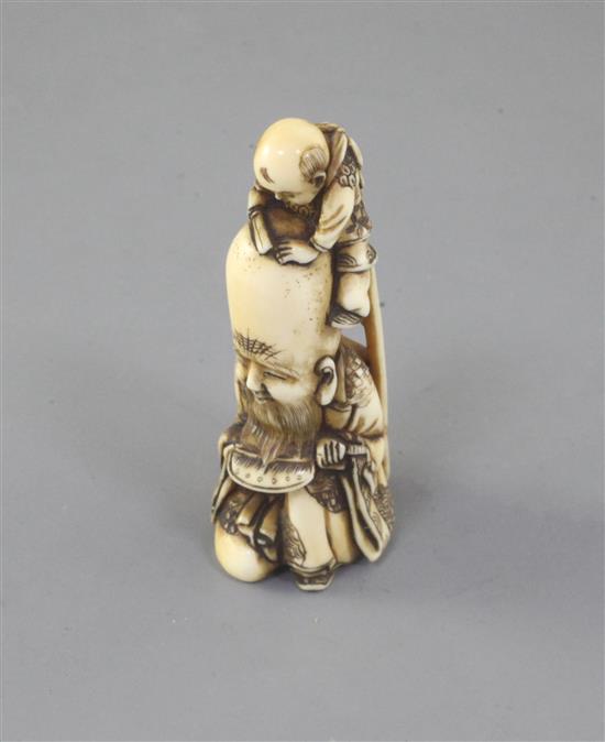 A Japanese ivory netsuke of Fukurokuju and a boy, 19th century, signed Minkoku, 6cm high (no.591)